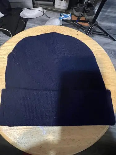 Navy blue knitted beanie with folded cuff for Kennedy Memorial Hockey Tournament