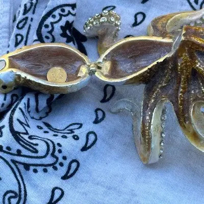 Open ornate octopus-shaped Keren Kopal crystal apple trinket box with gold coin inside