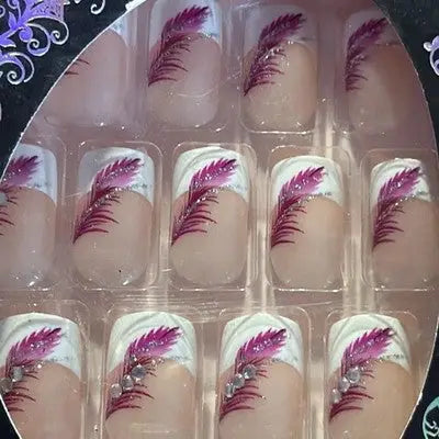 Kiss Luxury Magenta Feather Design Press-On Nails with glitter accents and feather pattern