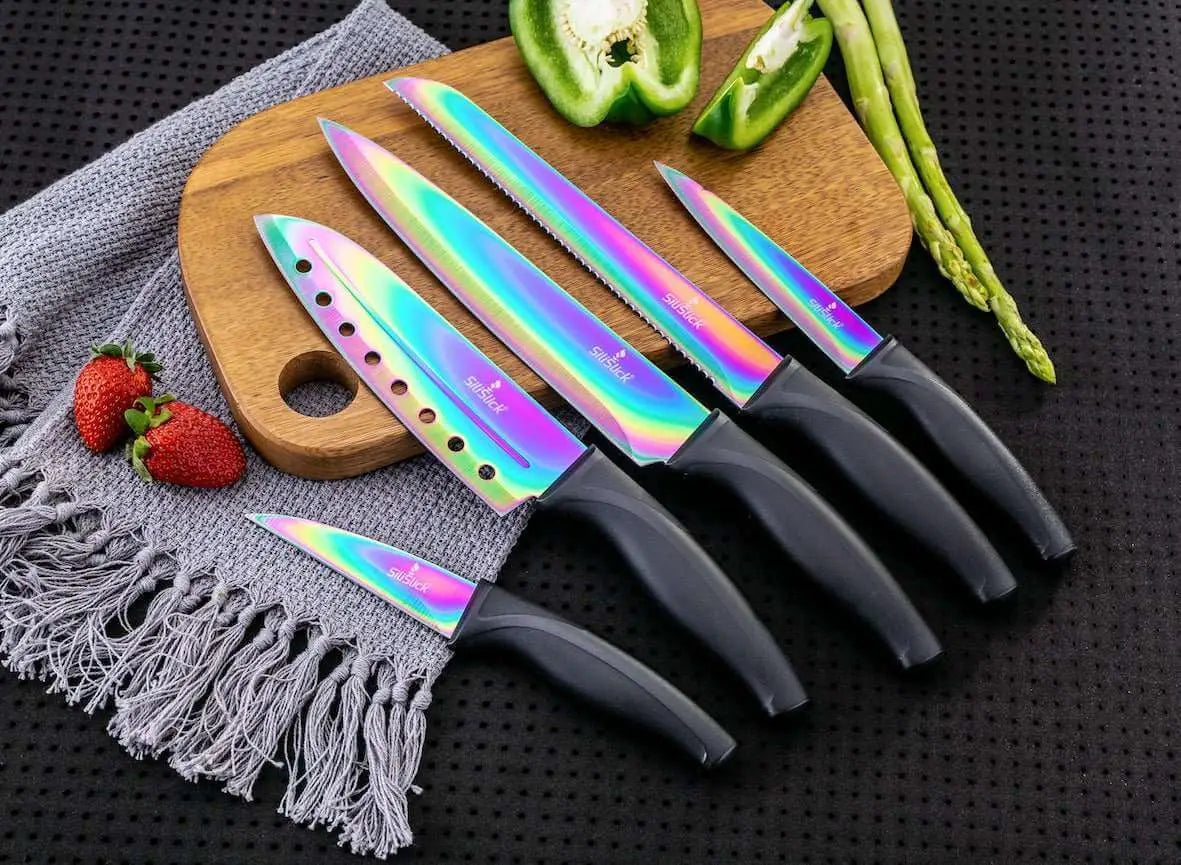 Iridescent kitchen knife set with black handles on magnetic rack and sharpener