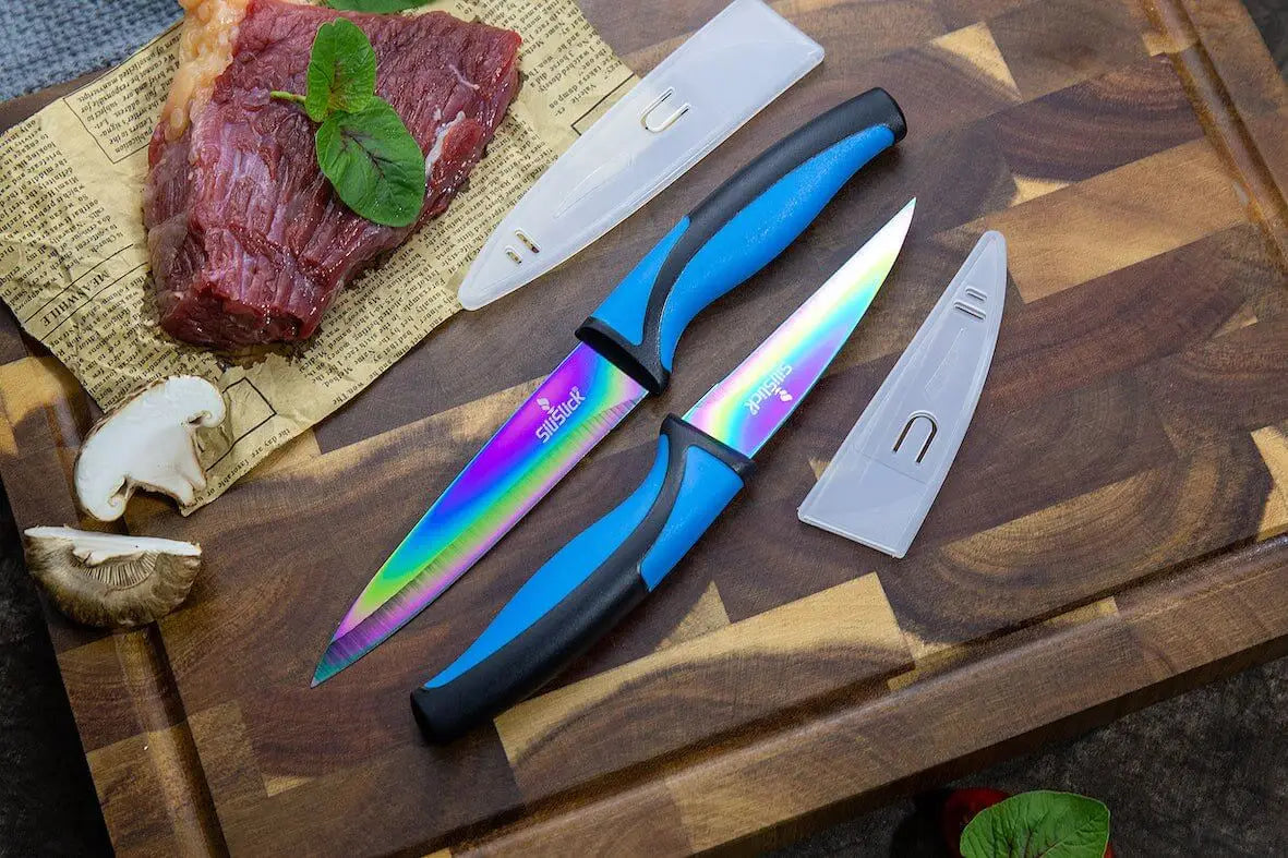 Rainbow-bladed knives with blue and black handles in a kitchen knife set kit with sheath