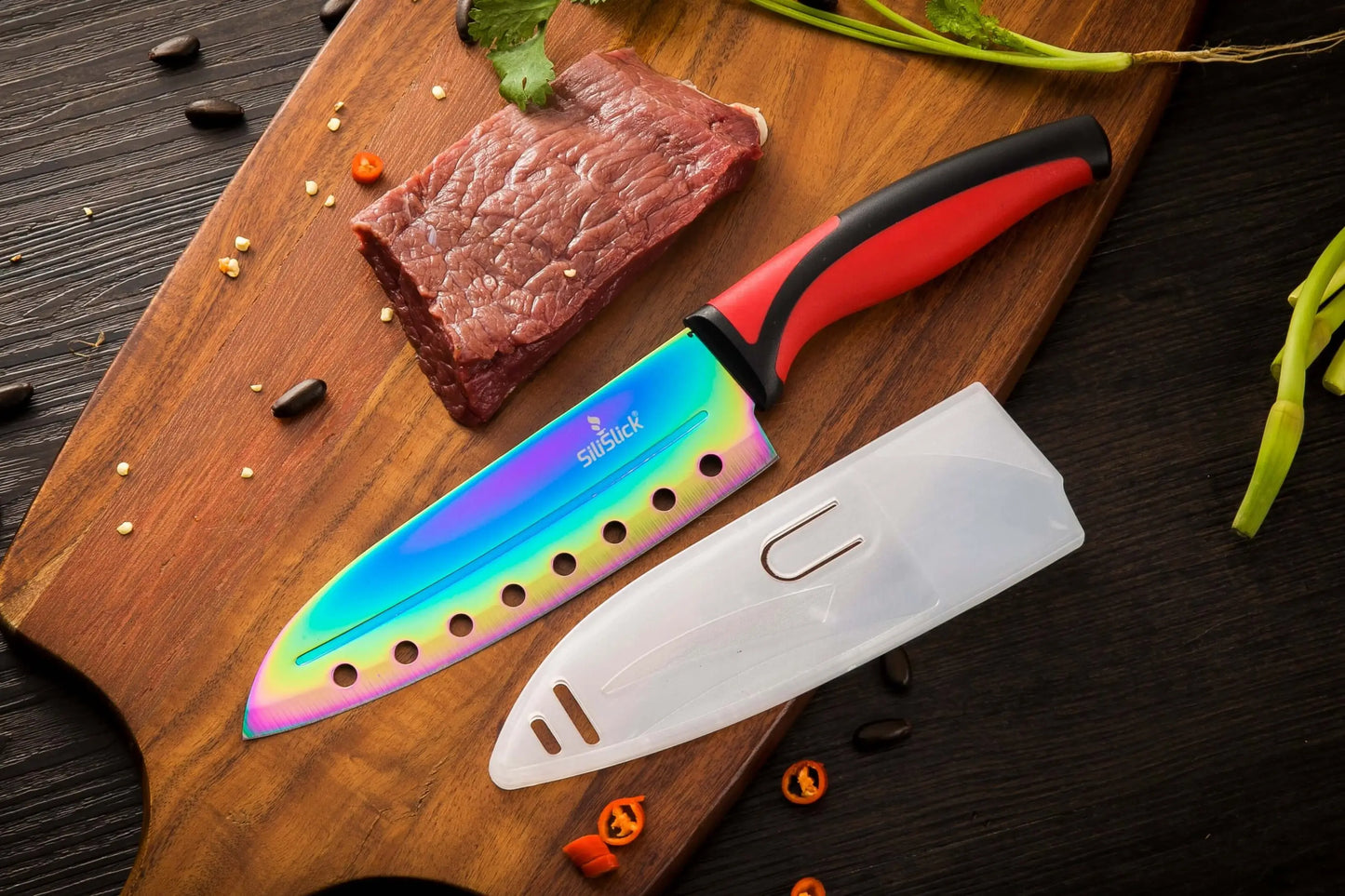 Rainbow-colored kitchen knife set with red handles, blade cover, and magnetic rack