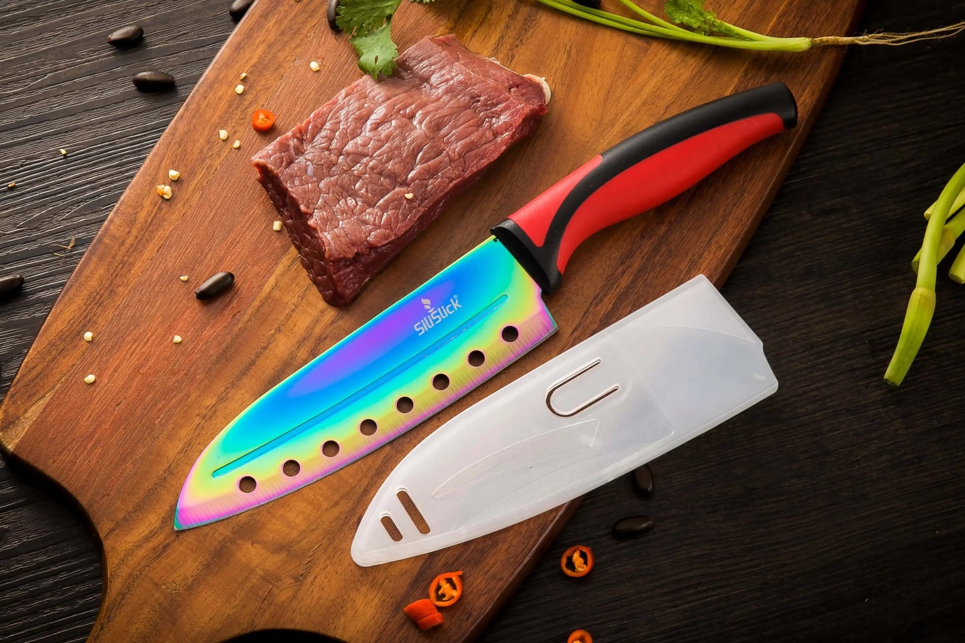 Rainbow-colored kitchen knife set with red handles, blade cover, and magnetic rack