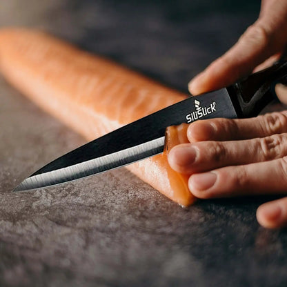 Black ceramic kitchen knife slicing salmon from Kitchen Knife Set Kit with magnetic rack