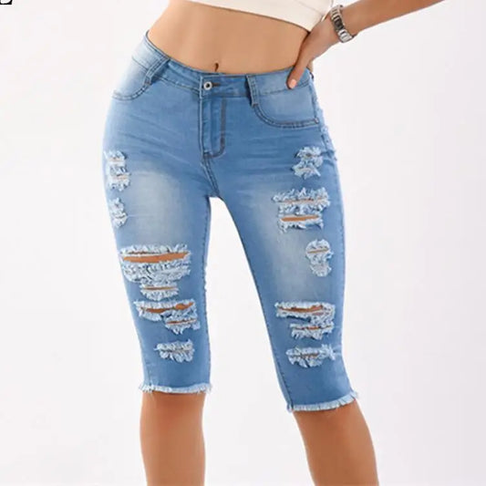 Light blue destroyed ripped jeans with frayed hem, knee length ripped jeans style