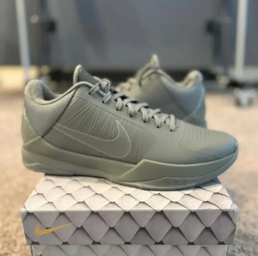 Monochromatic light green-grey Kobe 5 Fade To Black athletic shoes with Nike swoosh, fast shipping