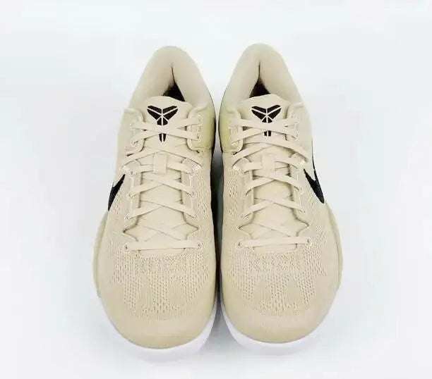 Light brown Nike Kobe basketball shoes with black accents, fast shipping available within business days