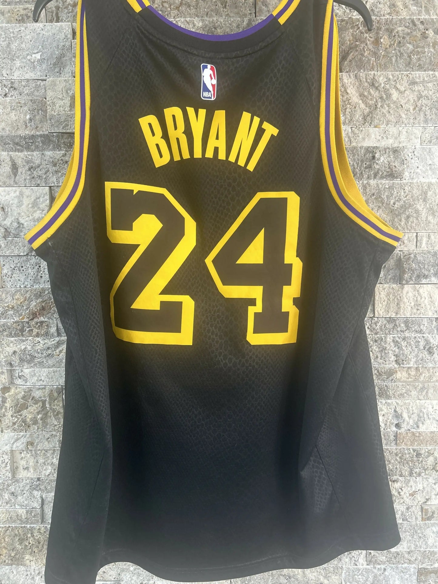 Kobe Bryant Black Momba Jersey in black and gold size 52 showcasing Bryant black Momba style