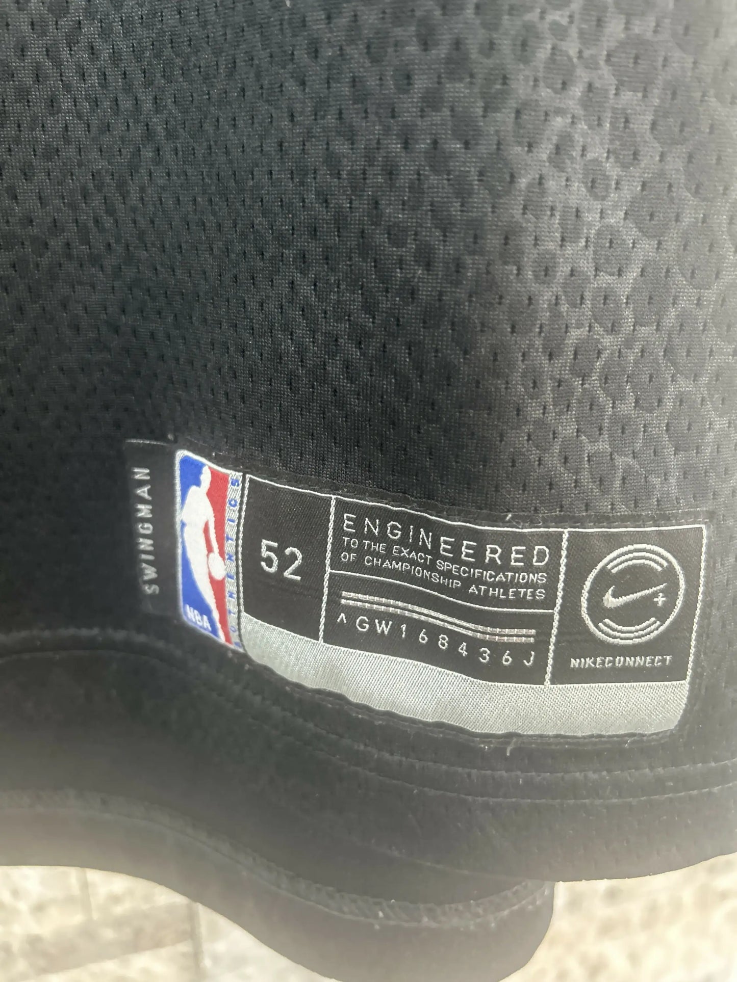 Black NBA Swingman jersey tag detail for Kobe Bryant Black Momba jersey size 52