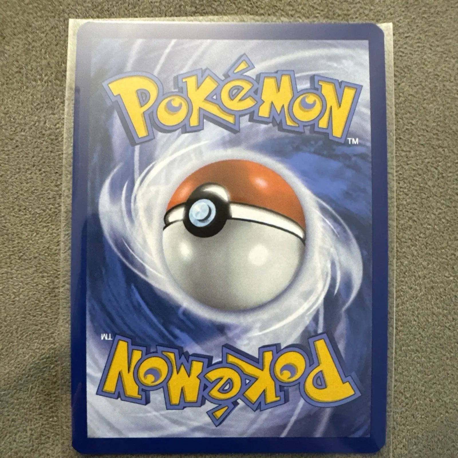 Pokémon TCG Koraidon card from Surging Sparks set, viewed from the back in NM condition