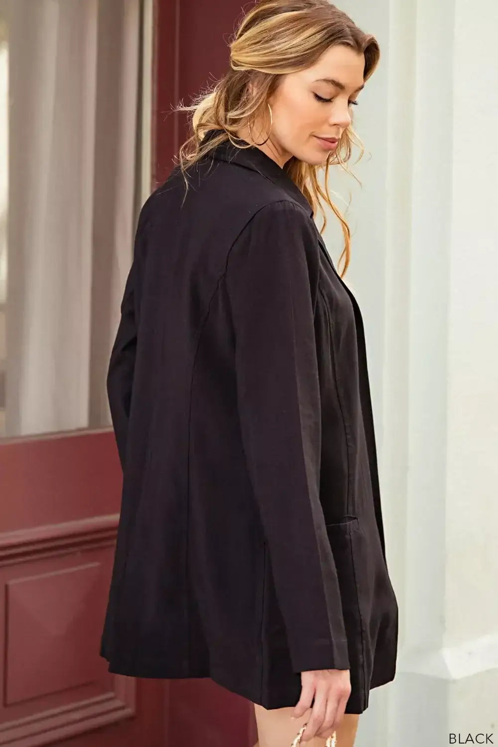 Black satin long sleeve blazer with high collar and button closure from Kori America