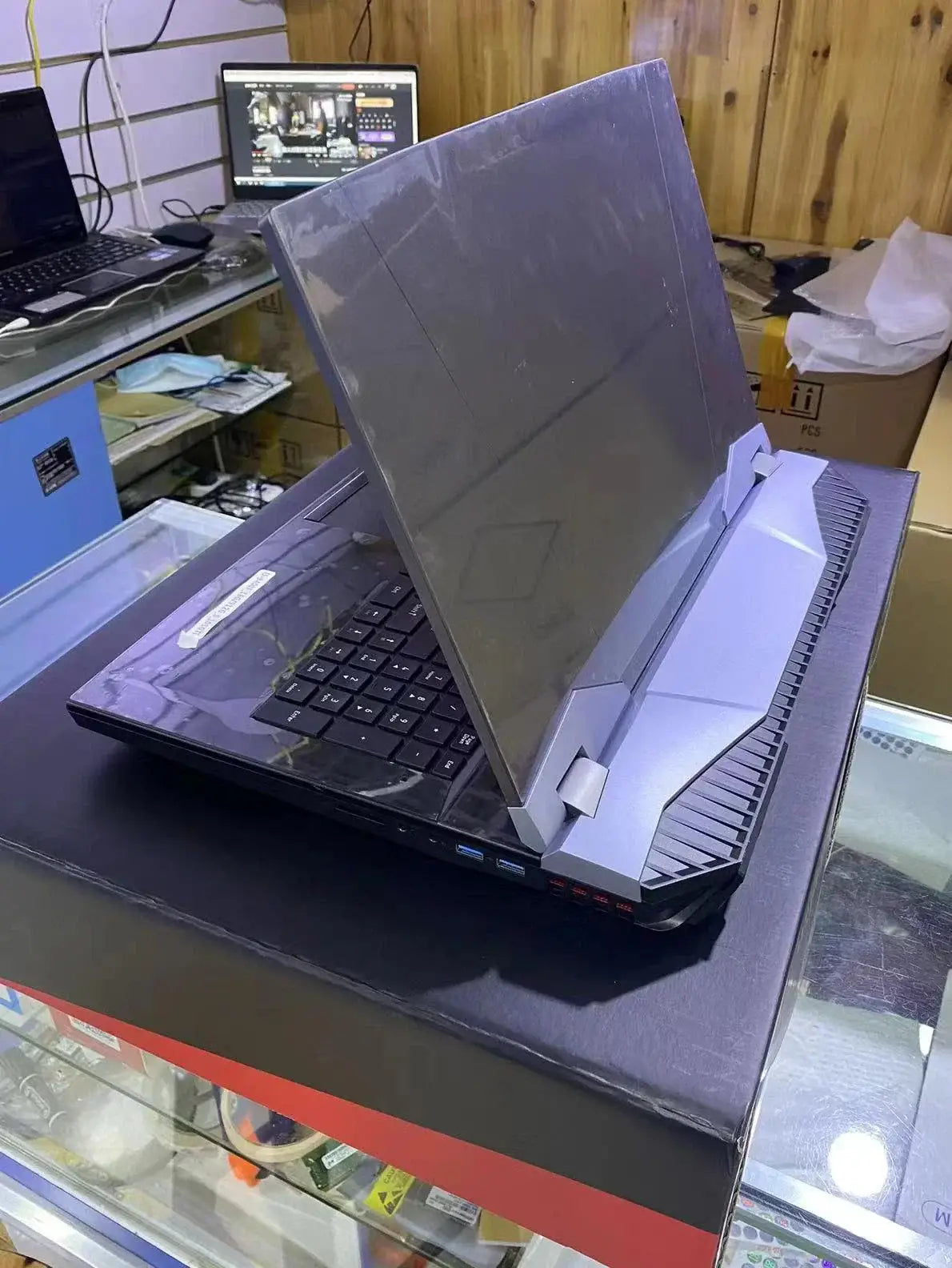 Black Gaming Laptop B17A with grey screen protector and exposed cooling vent, 750px width