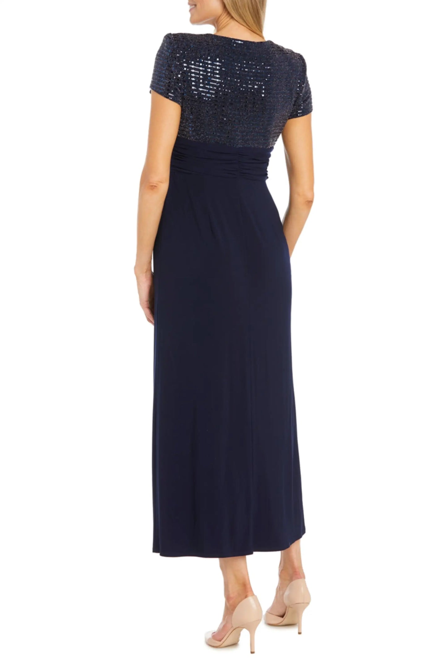 Woman in navy blue sequined short-sleeve bodice evening gown for formal occasions