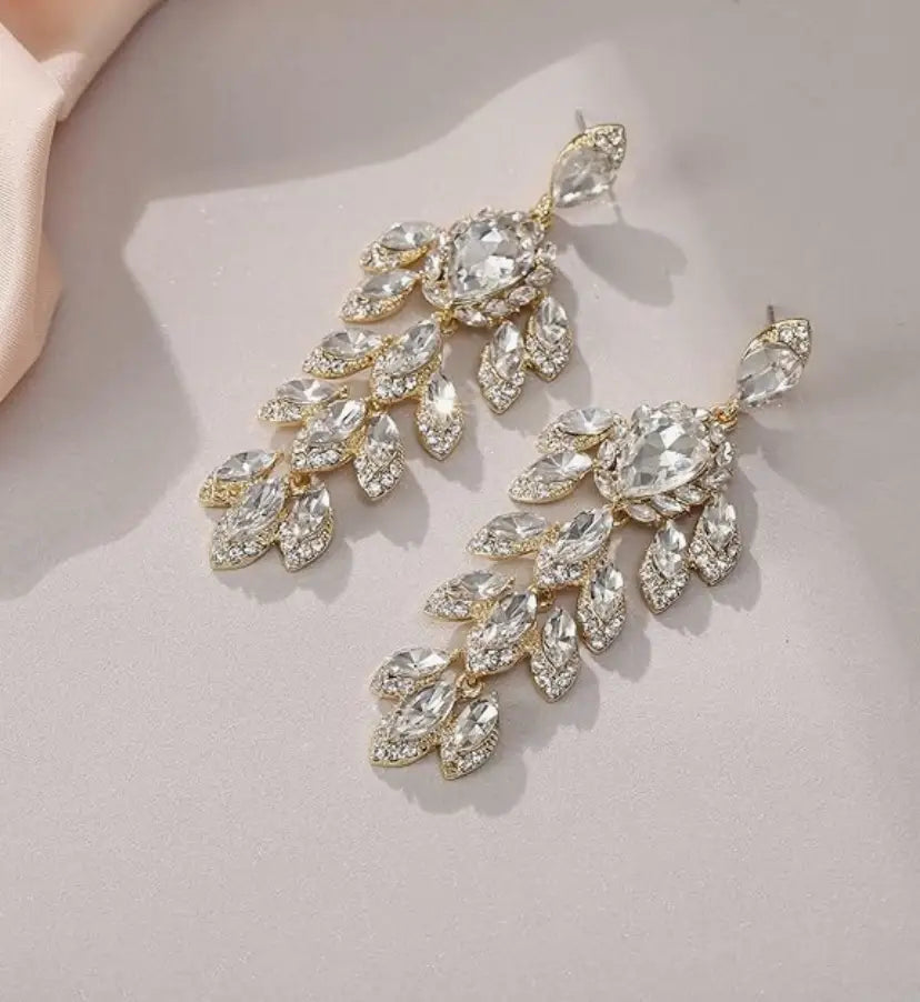 Gold-toned crystal chandelier dangle earrings with marquise and pear-shaped rhinestones for ear piercing