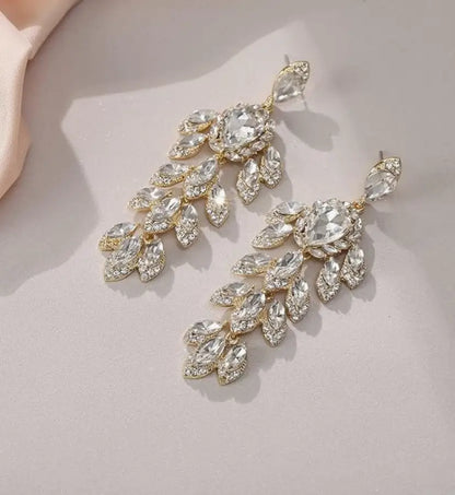 Gold-toned crystal chandelier dangle earrings with marquise and pear-shaped rhinestones for ear piercing