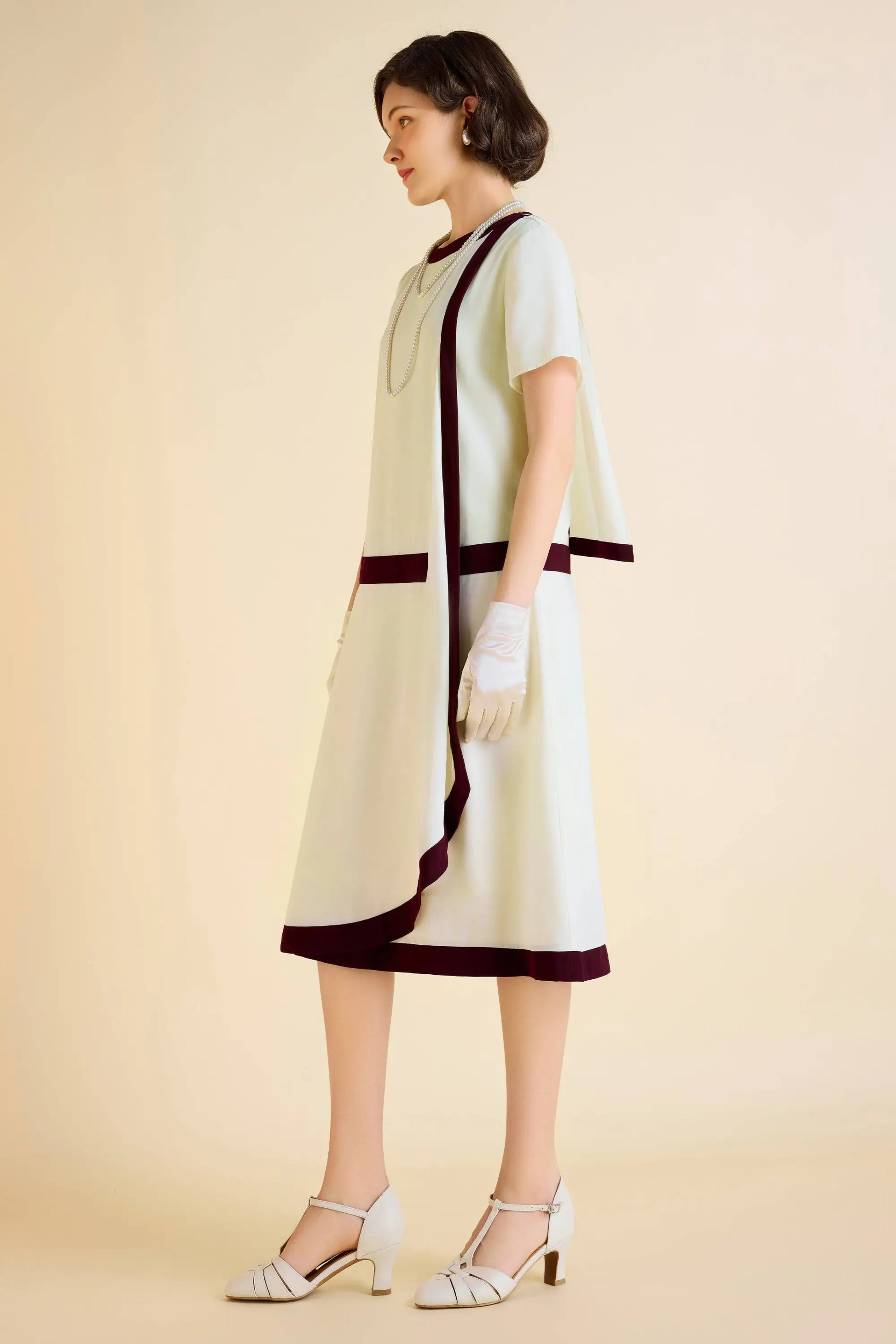 Cream-colored Downton Abbey replica dress with draped cascading cape and asymmetrical hem