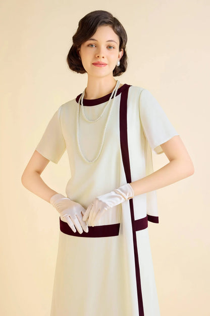 Cream-colored Downton Abbey replica dress with burgundy trim and draped cascading ruffles
