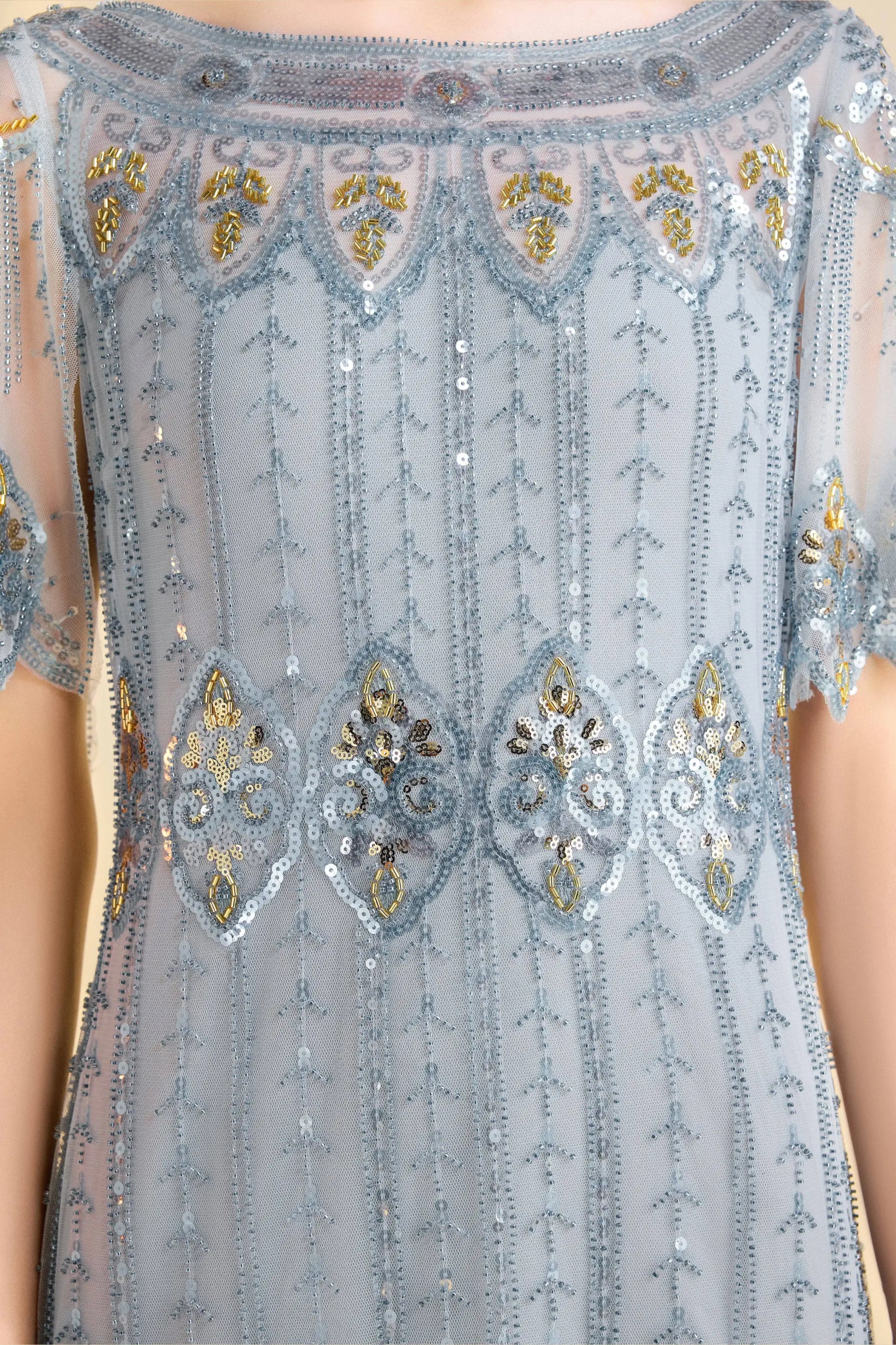 Sky blue beaded flapper dress with gold embellishments and short sleeves for cocktail wear