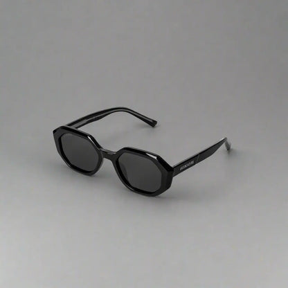 Black octagonal-framed sunglasses with dark lenses from LatenzaZero women’s UV3 Veritas_X242