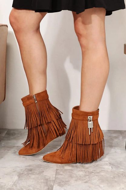 Tan suede Legend Womens Tassel ankle booties with fringe, wedge heel, and silver hardware