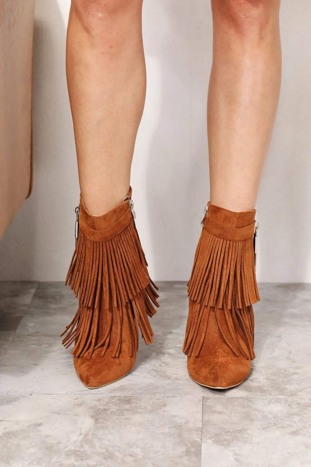Tan suede Legend Womens Tassel ankle booties with layered fringes and wedge heel