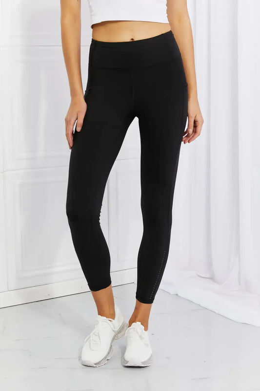 Black ankle-length active leggings with high waist and reflective dot details from Leggings Depot