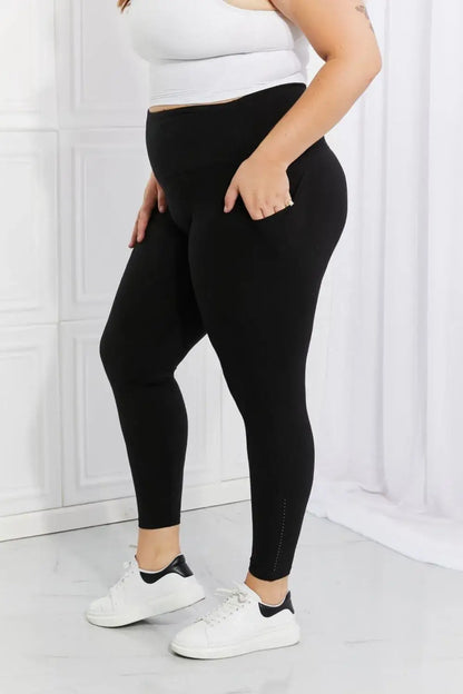 Plus-size black active leggings with side pockets and ankle zippers from Leggings Depot