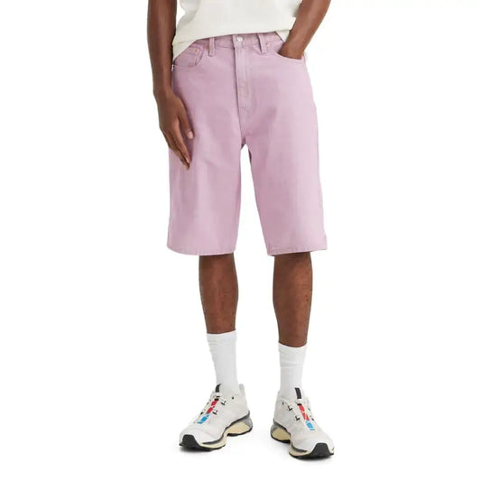 Pink denim shorts shown in Levis Mens 569 Loose Straight Denim Shorts product image