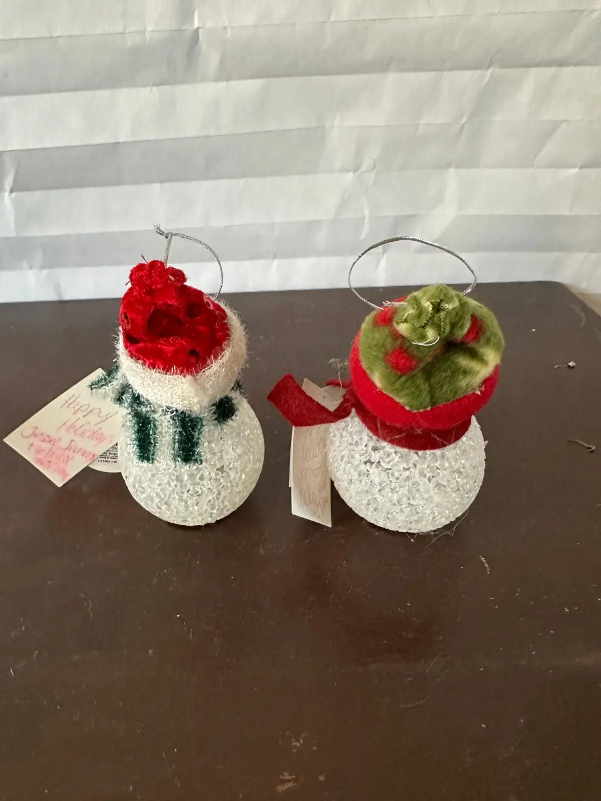 Glittery snowman Christmas ornaments set with festive hats and scarves for holiday decor