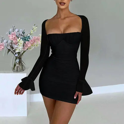 Woman in black long sleeve high-waisted bodycon dress with square neckline and flared cuffs