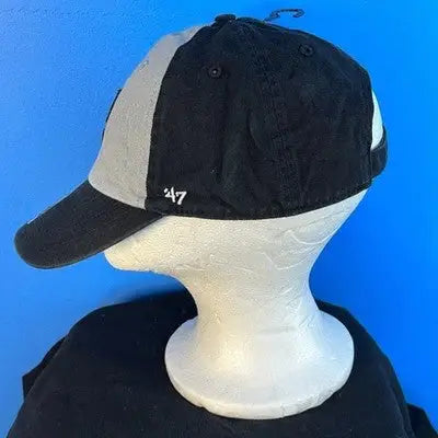 Black and grey Los Angeles Kings 47 Clean Up Hat with Silver Logo on mannequin head
