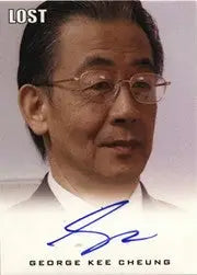 Headshot of an older Asian man in a suit with glasses for George Kee Cheung Autograph Card