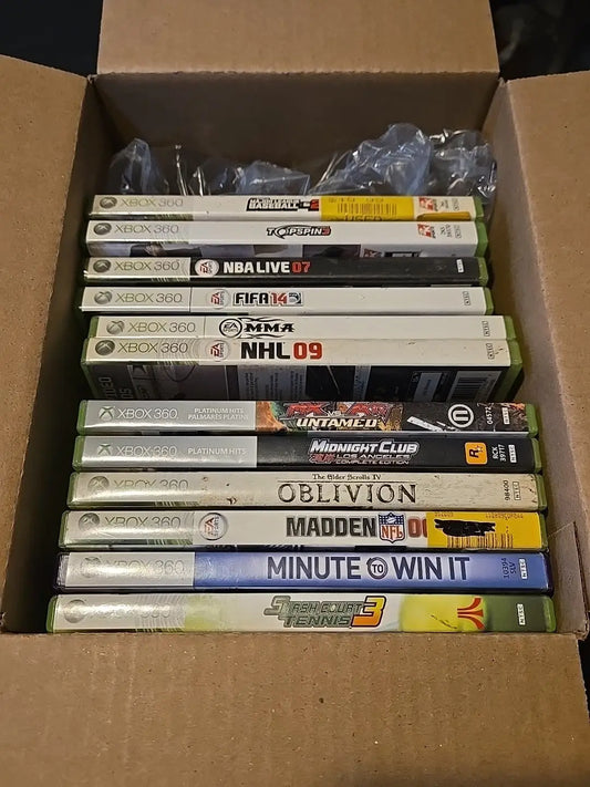 Box of used Xbox 360 games in a lot includes popular titles for gaming enthusiasts