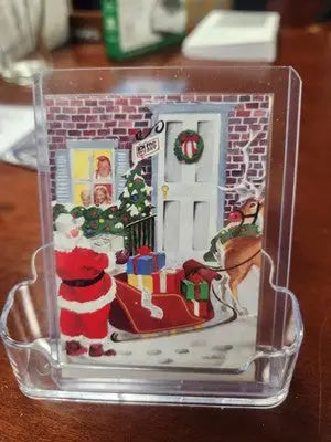 Christmas-themed acrylic card holder featuring Santa Claus for NFL Football Pro Set cards