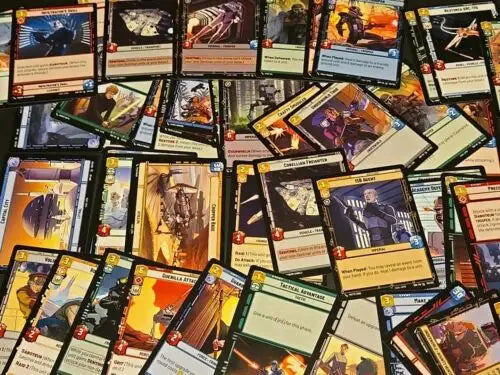 Scattered Star Wars trading cards from a Lot Of 200+ Star Wars TCG Cards collection