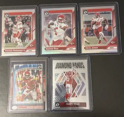 Collection of Kansas City Chiefs NFL trading cards featuring Mahomes and Kelce from 2024