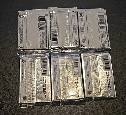 Six unopened Upper Deck hockey card packs from the 1990-91/1991-92 series