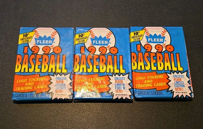 Three 1990 Fleer baseball card packs featuring classic players from the era