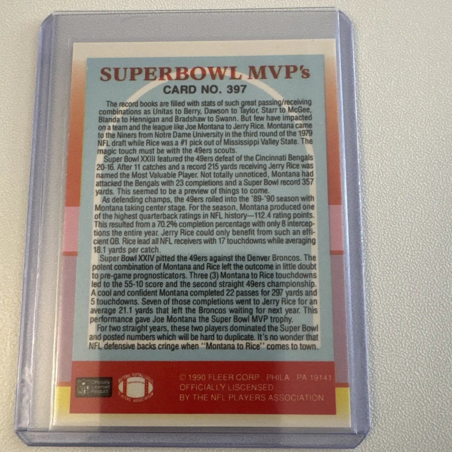 Collectible football card featuring Jerry Rice, Joe Montana, and Ronnie Lott in protective sleeve