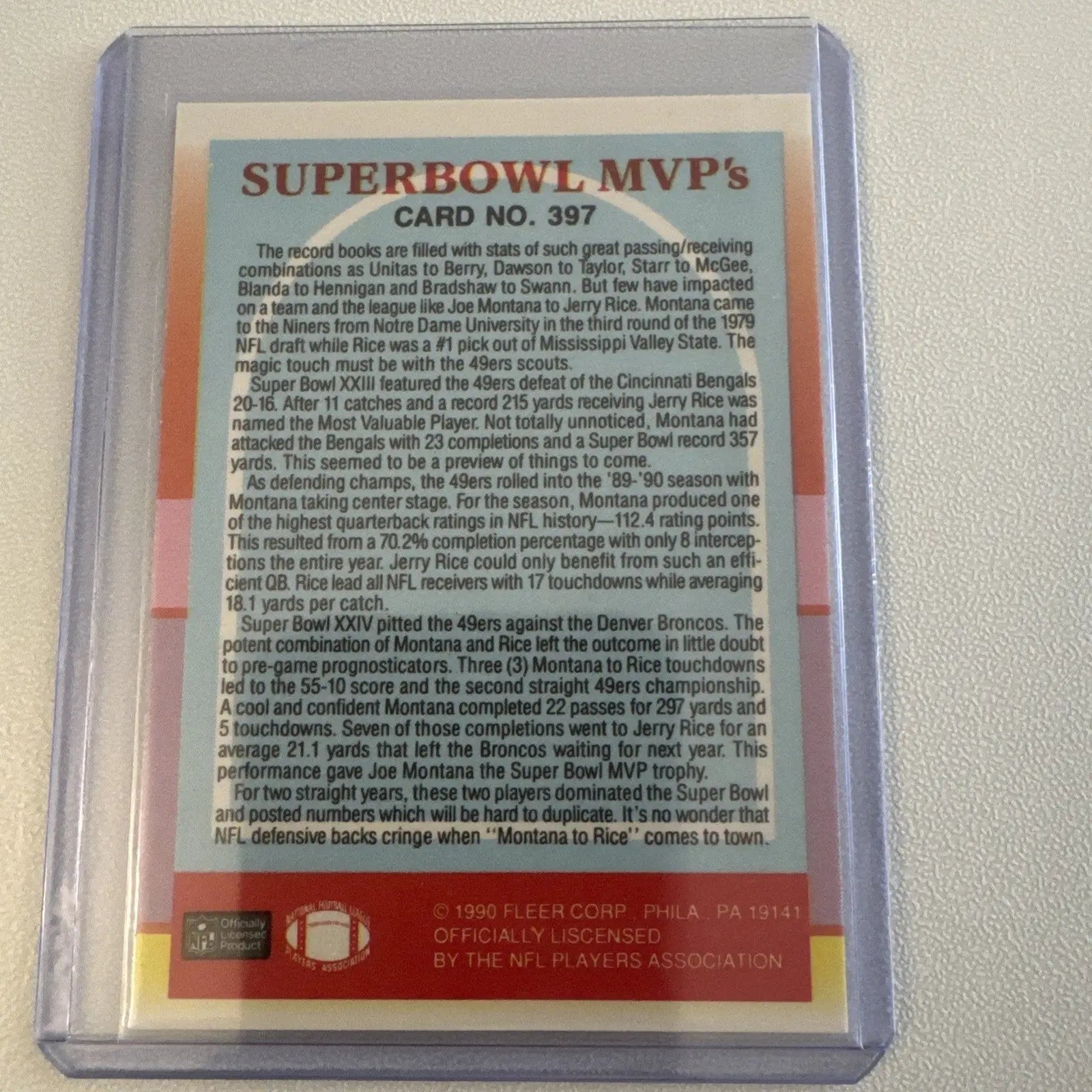 Collectible football card featuring Jerry Rice, Joe Montana, and Ronnie Lott in protective sleeve
