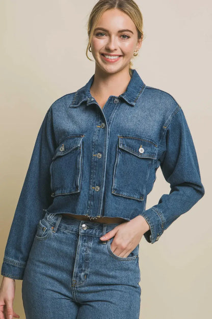 Denim jacket with raw hem, button-up front, patch pockets, dark blue color
