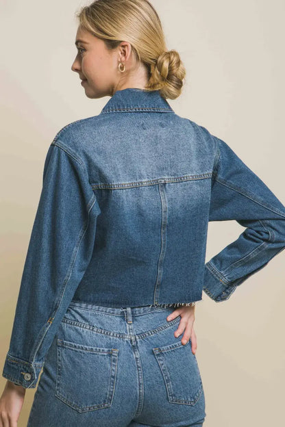 Denim jacket with raw hem, button-up front, rolled sleeves, medium blue color