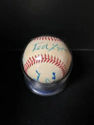 Autographed auto ball baseball in a protective case featuring multiple Hall of Famers