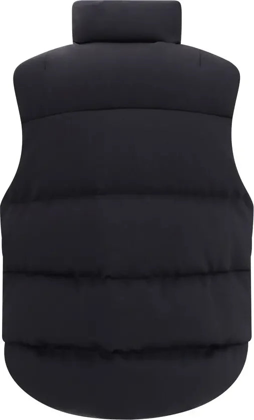 Black puffer vest on a white background