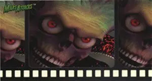 Grotesque Martian face with glowing eyes in film strip for Mars Attacks promo card
