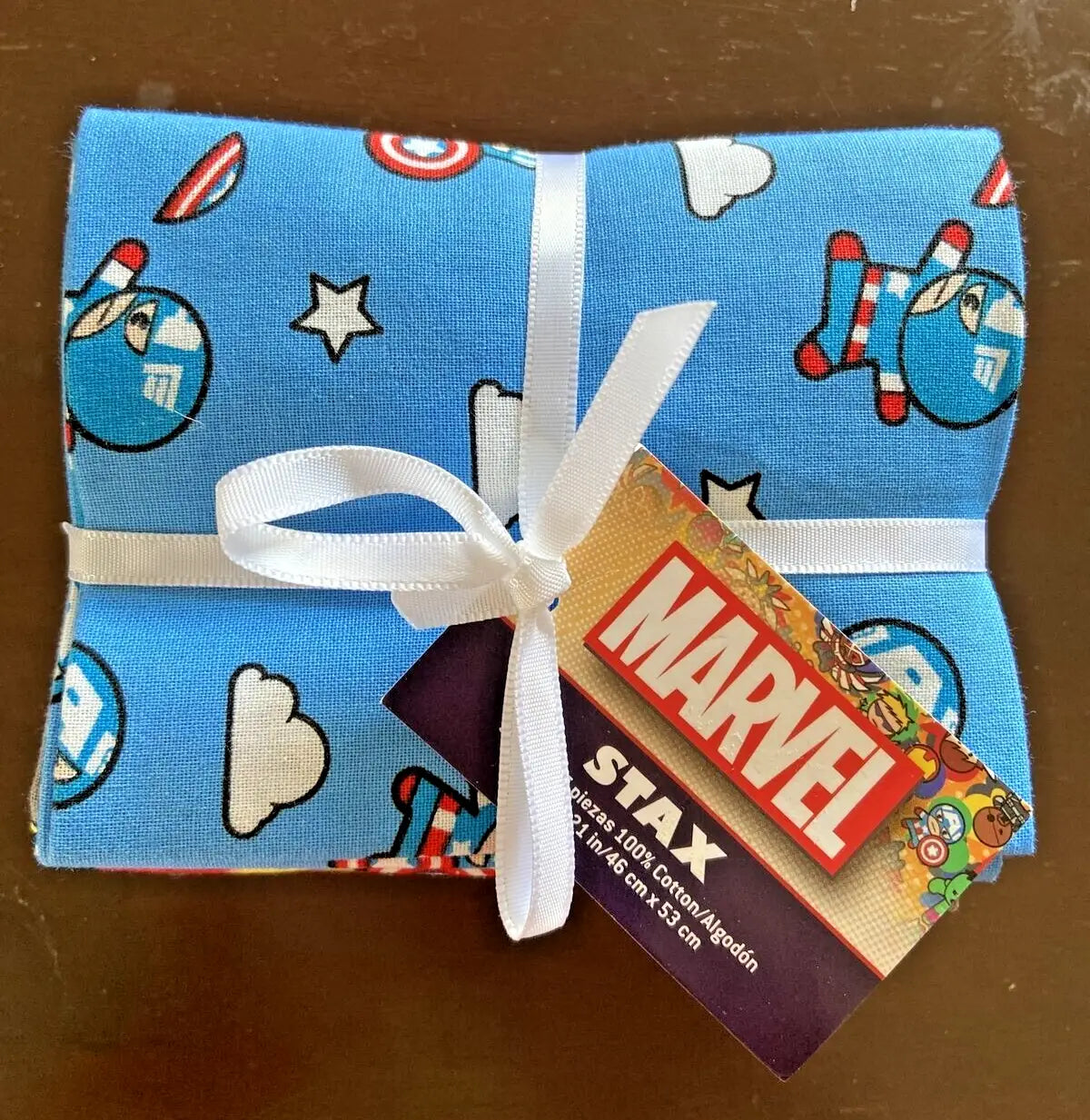 Blue Marvel Comics Fat Quarter Stax Bundle with Captain America-themed fabric tied with a white ribbon