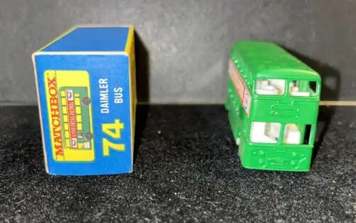 Green toy double-decker 74B Daimler Bus in box, featuring Bus Green Esso design