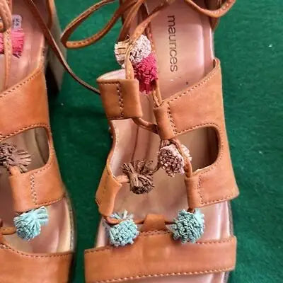 Brown leather strappy sandals with colorful pom-poms from Maurice’s light rust lace zipper sandals block heel collection