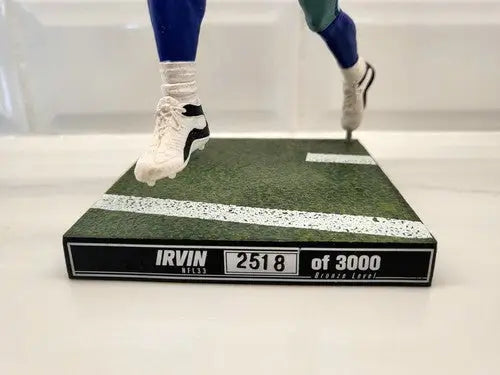 Michael Irvin action figure from McFarlane NFL Series 33 on football field base