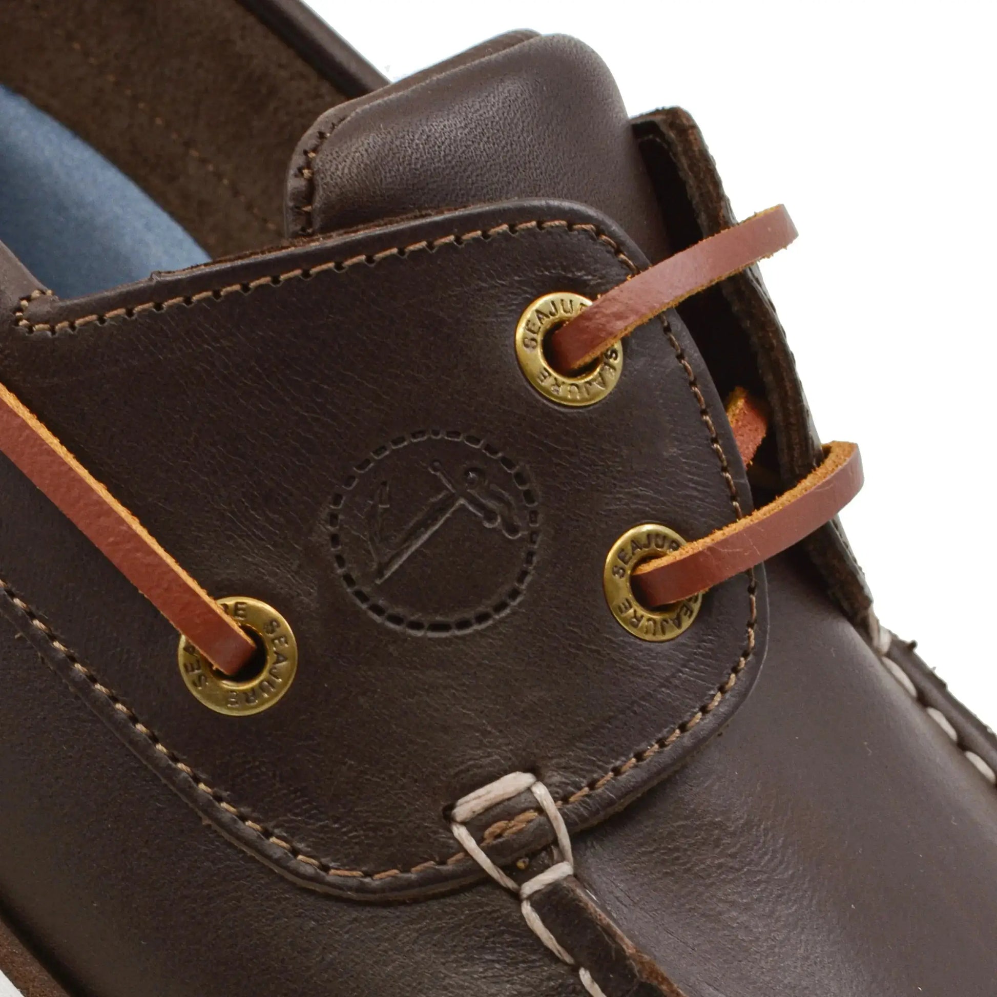 Close-up of high-quality men boat shoe Forvie with dark brown leather and gold-tone eyelets